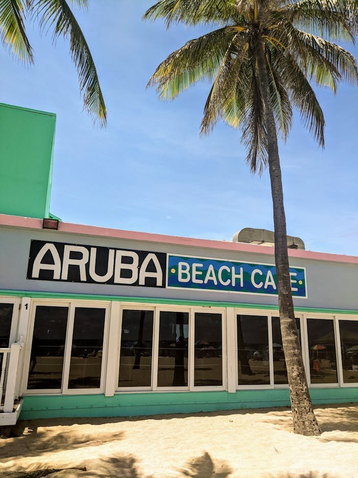A colorful Aruba Beach Cafe under sunny skies, perfect for tropical getaways.